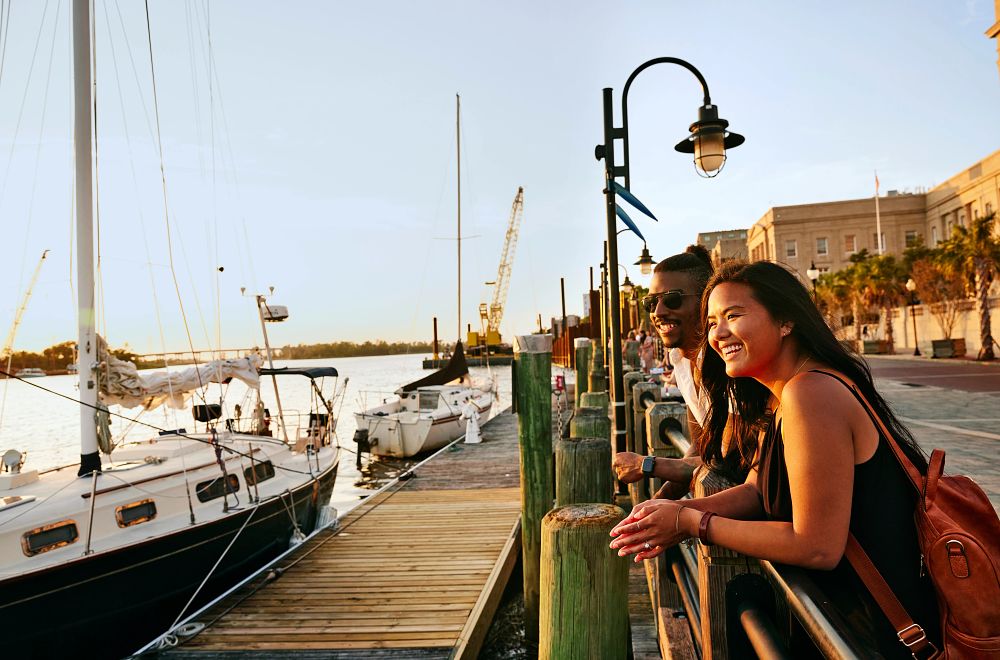 couple smiling at cape fear riverwalk