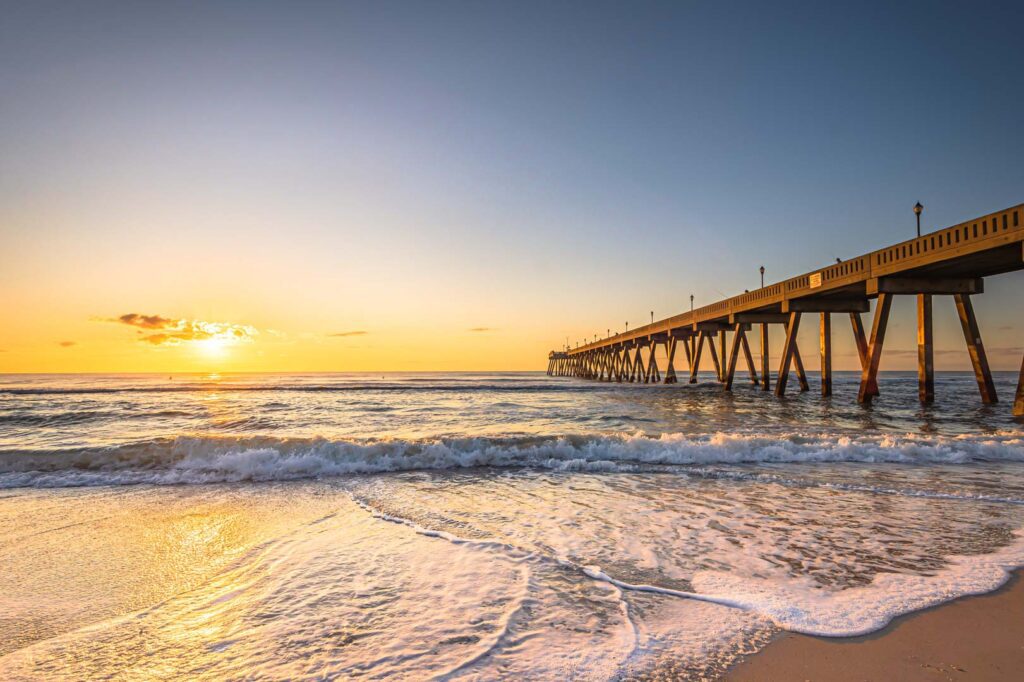 beach pier at sunset