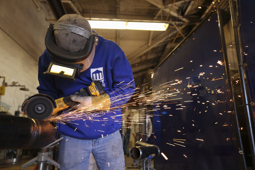 student welding at PCC