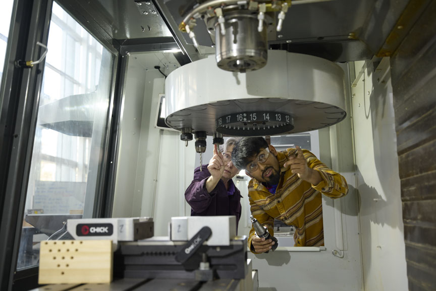 student with instructor in lab