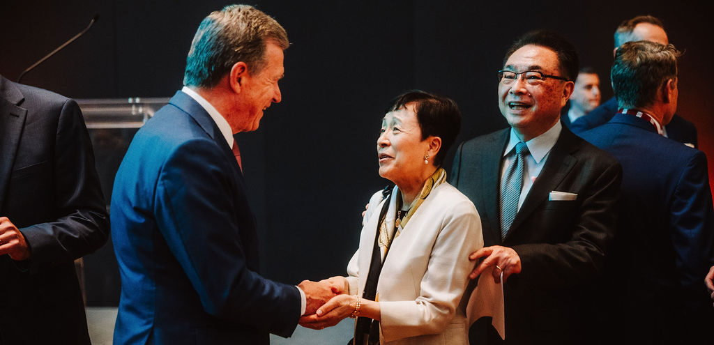 Governor Cooper shaking hand of Japanese Official