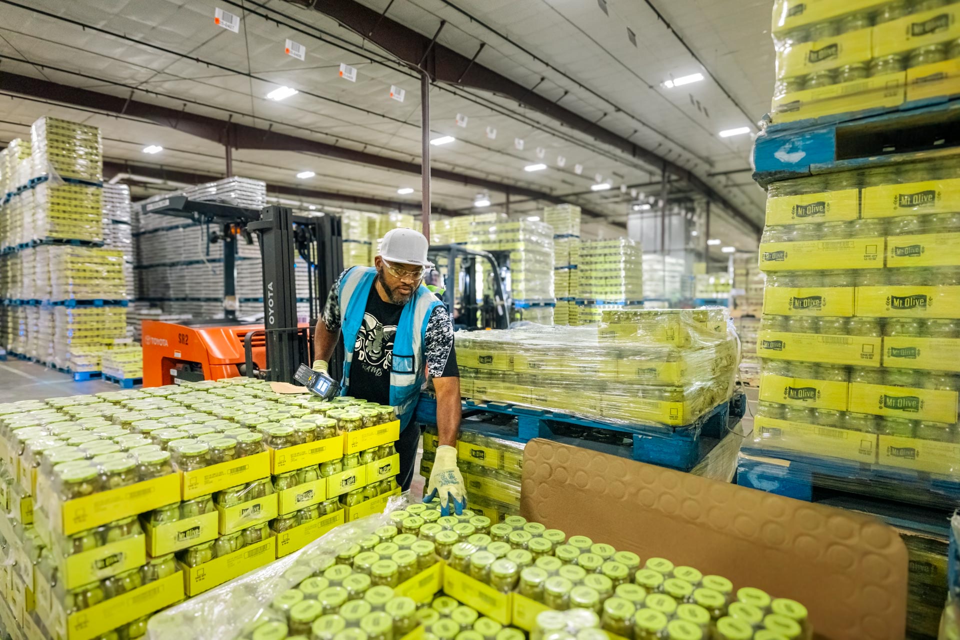 worker packaging products at Mt Olive pickle factory