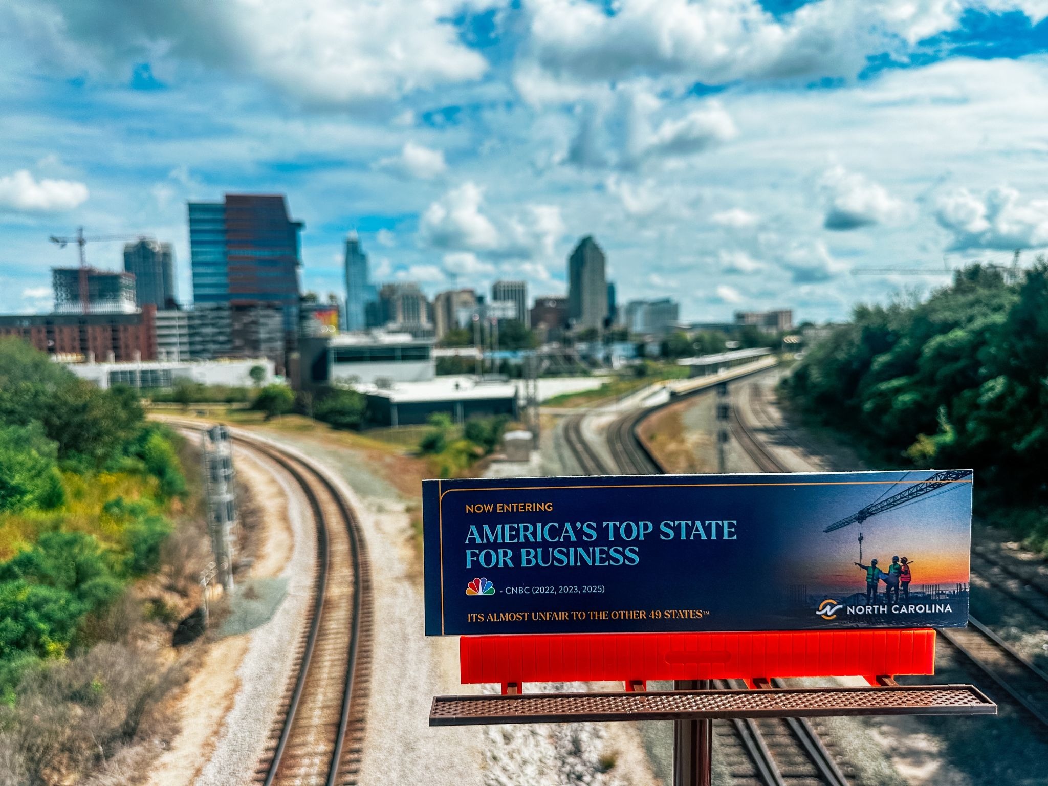 CNBC Billboard Campaign, mini billboard overlooking Downtown Raleigh by a rail line