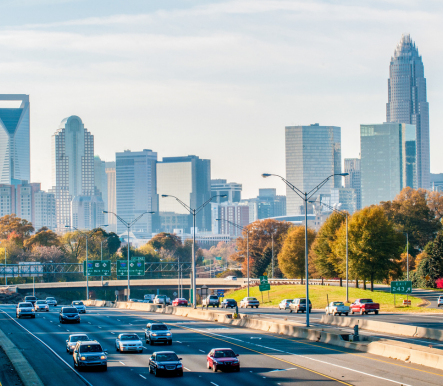 Aerial view of highway system and Charlotte skyline