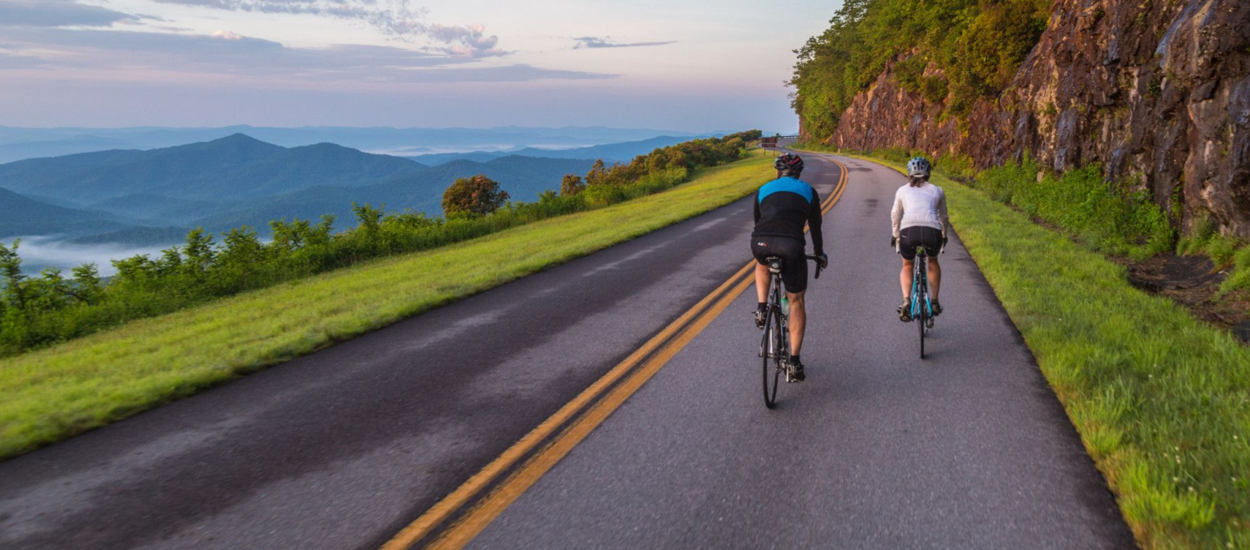 two people road biking along the blue ridge parkway